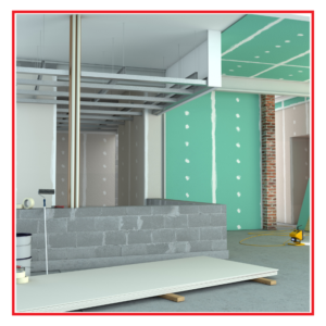 An image of a building under remodel. Showing drywall and building materials.