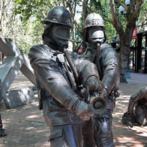 Image of the fire fighter memorial from the 1995 Seattle Warehouse fire. Shows two fire fighter bronze statues. 