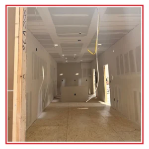 Modular Building under construction. Showing the interior of wood framing and dry wall.