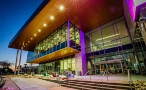 West Las Vegas Library. Image of front porch architecture in the front of the library. A shot taken at dusk showing the beautiful lighting of purple and pink colors.